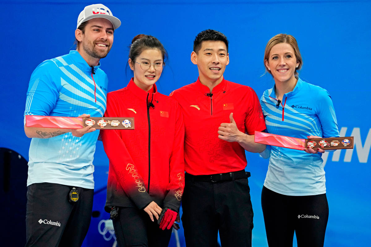 and vicky persinger (first right) from the us receive a gift