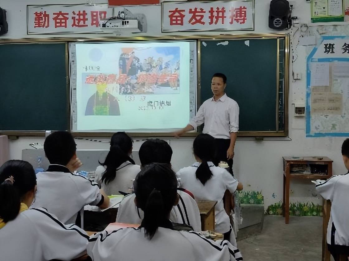 化州平定圣古中学校长图片