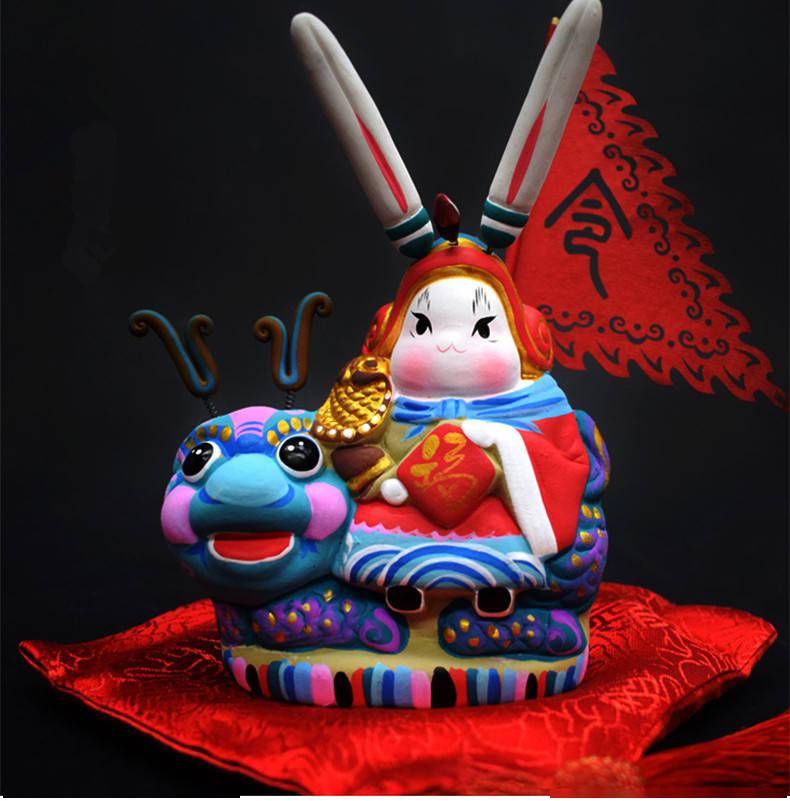 看吧,这段绘声绘色的文字已形象地勾勒出了"兔儿爷"的模样了.