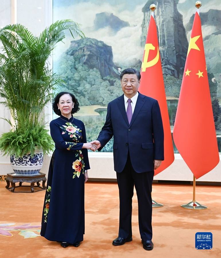 习近平会见越共中央政治局委员、中央书记处常务书记、中组部部长张氏梅_发展_合作伙伴关系_中越